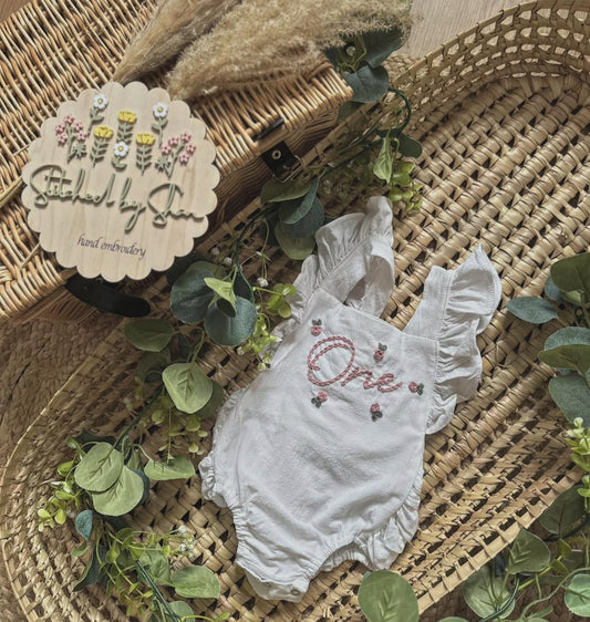 "ONE" rosebuds romper